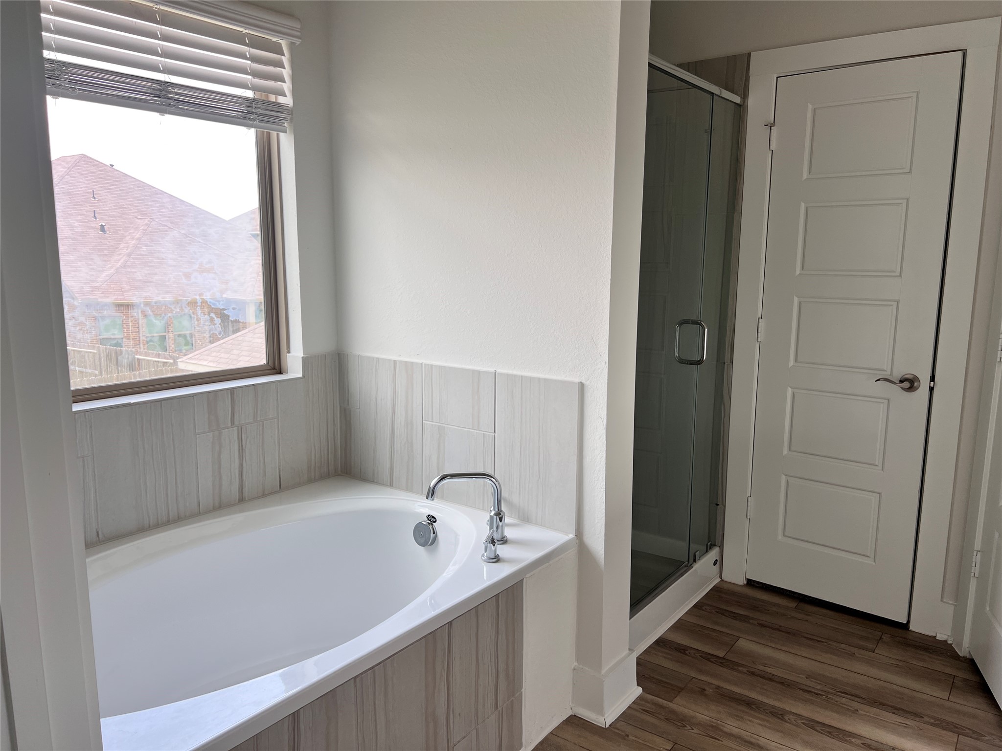 10638 Whitejacket Conroe, TX 77385 - Photo 24 of 25 a bathroom with a tub and a window