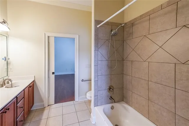 a bathroom with a tub a sink and mirror
