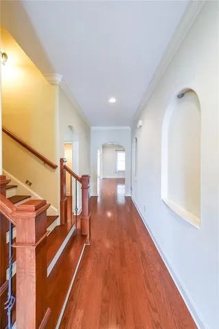 a view of a room with wooden floor