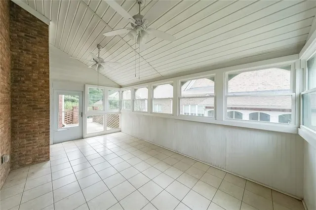 a view of a brick wall in front of house