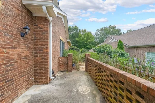 a balcony with table and chairs