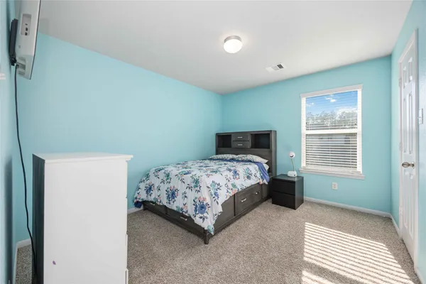 a bathroom with a sink a toilet a shower and a mirror