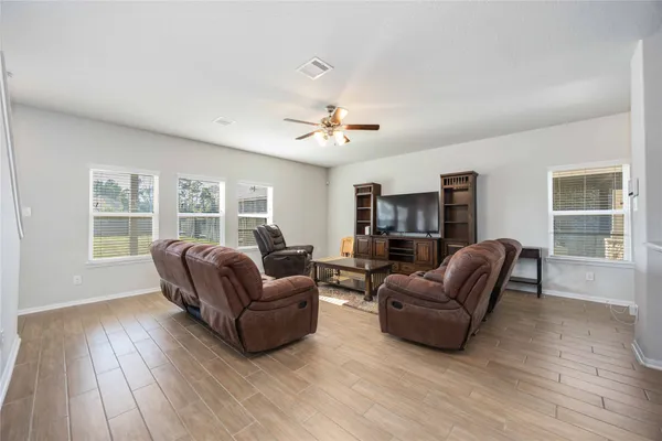 a living room with furniture and a window