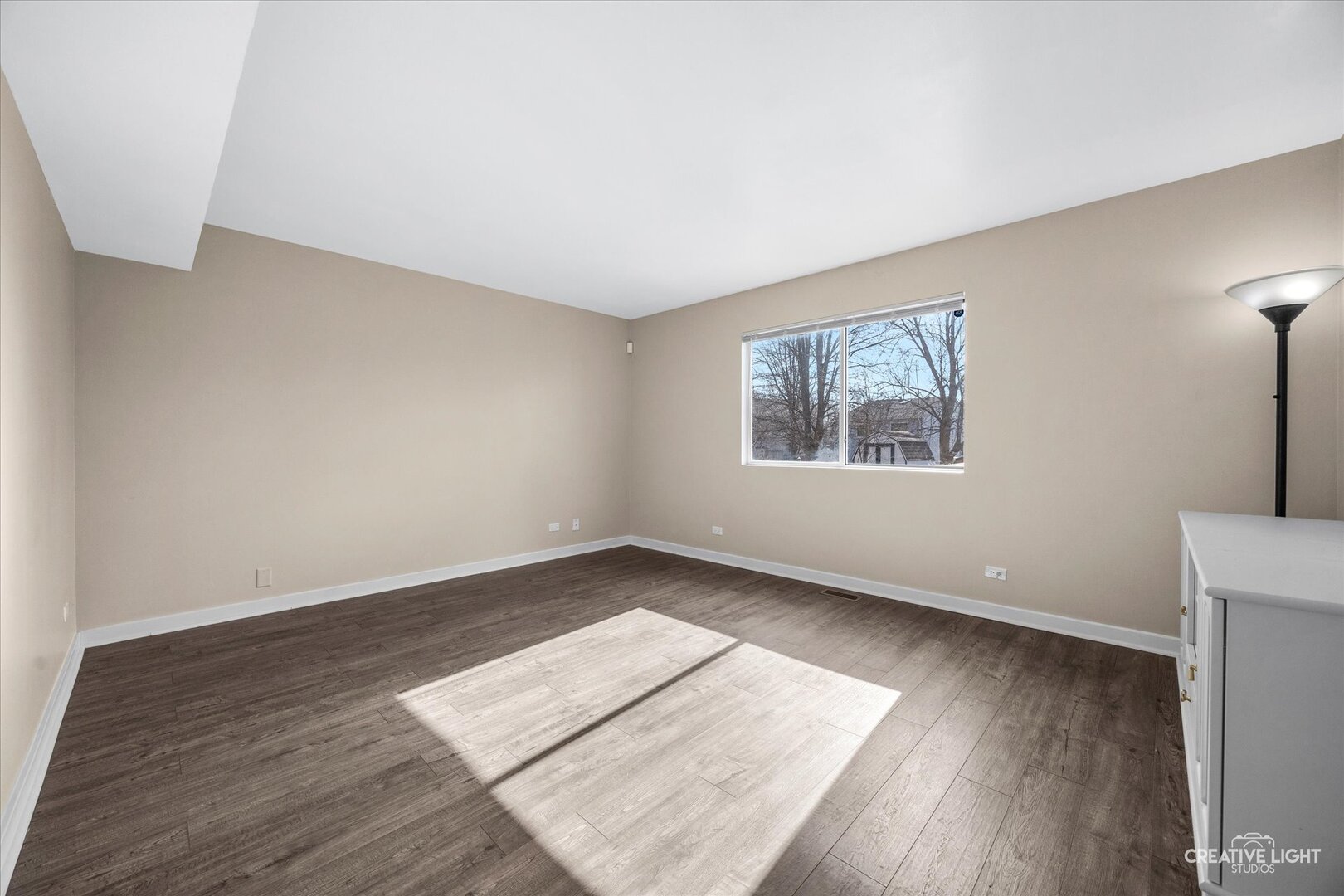 1221 Longford Circle Elgin, IL 60120 - Photo 12 of 29 an empty room with wooden floor and windows