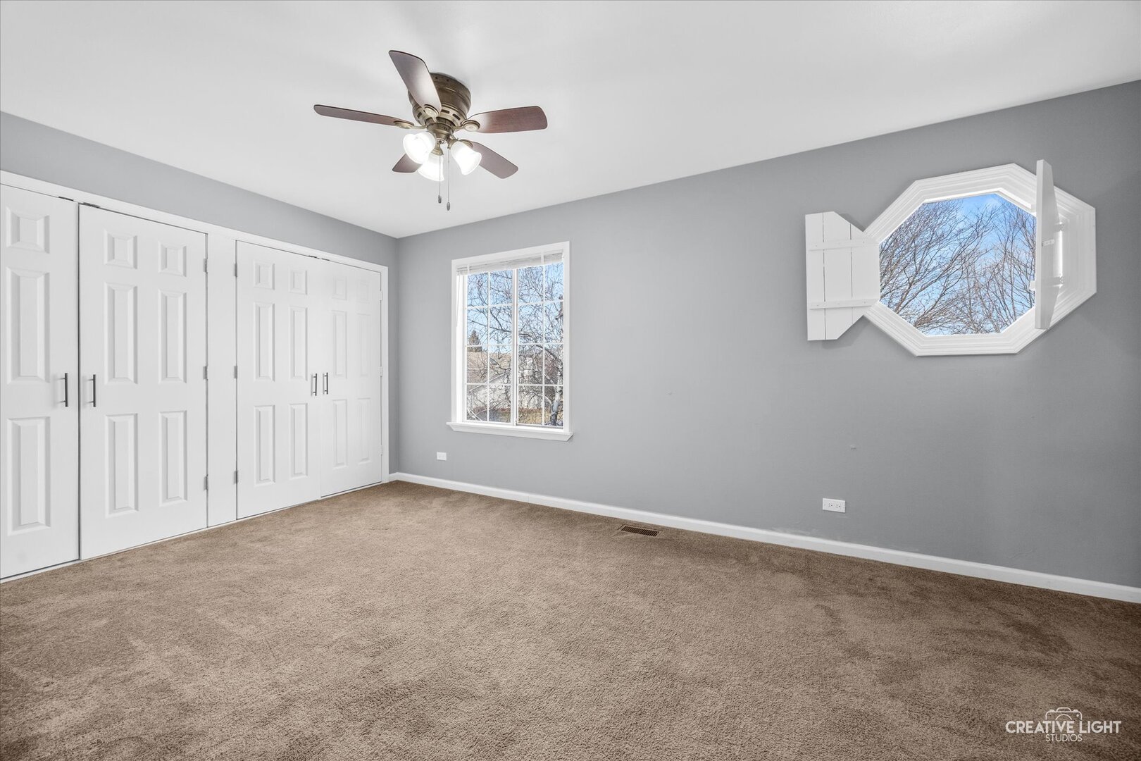 1221 Longford Circle Elgin, IL 60120 - Photo 17 of 29 an empty room with windows and fan