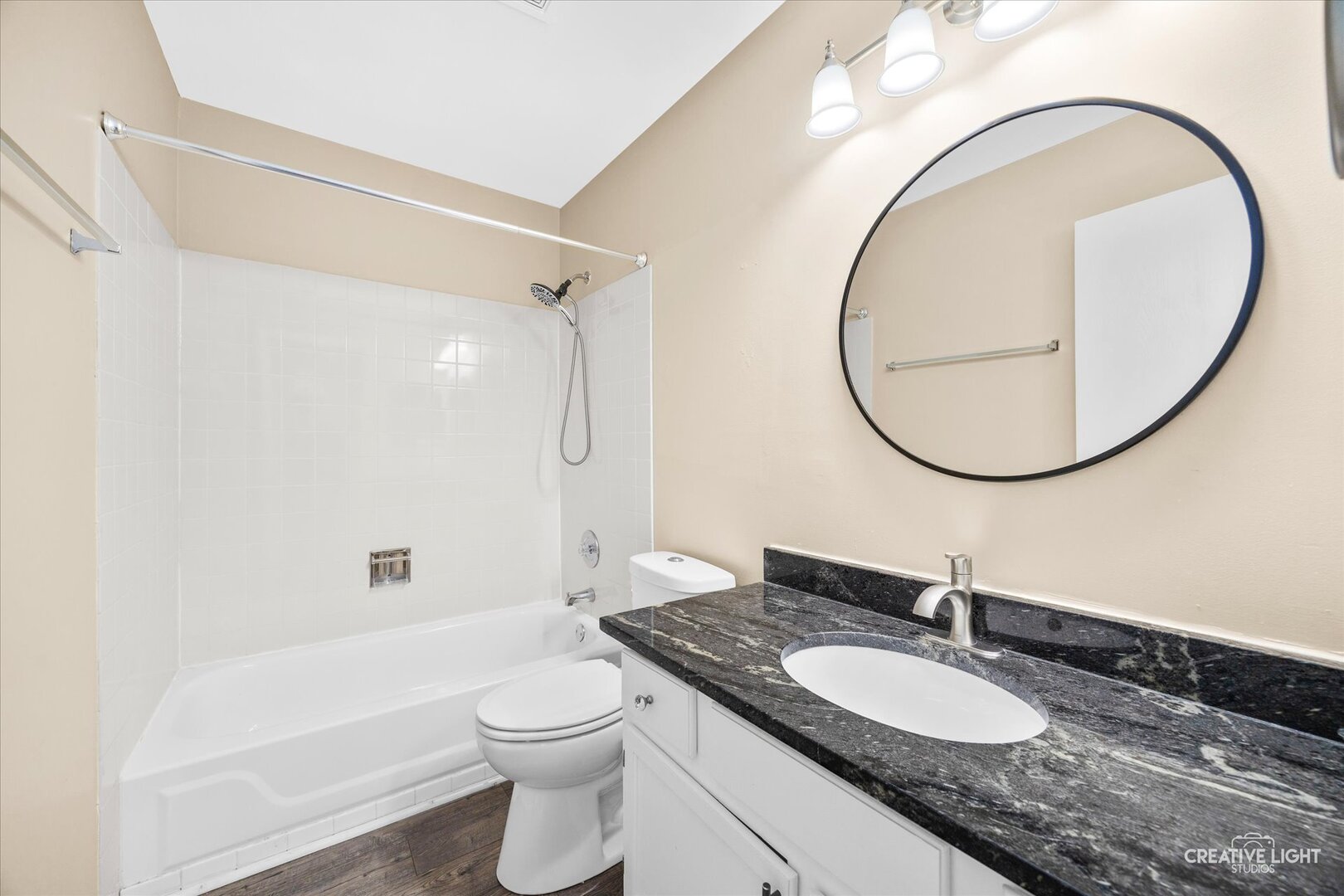 1221 Longford Circle Elgin, IL 60120 - Photo 19 of 29 a bathroom with a granite countertop toilet a sink and a mirror