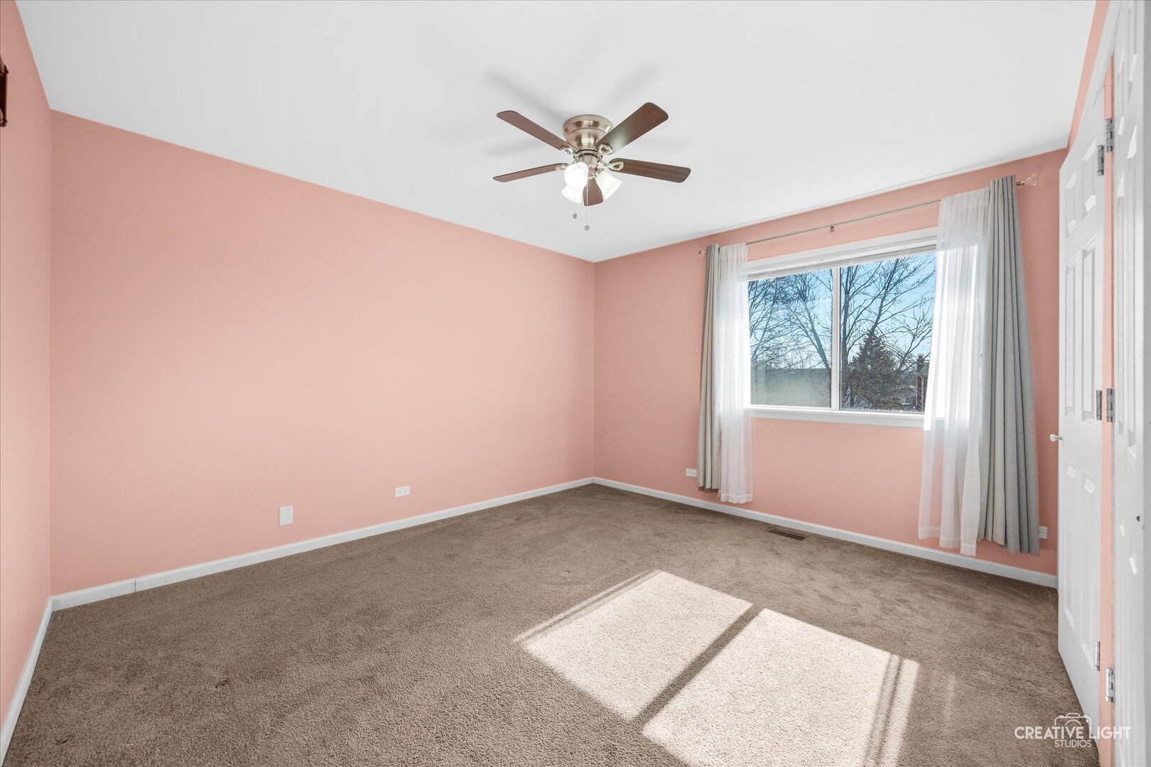 1221 Longford Circle Elgin, IL 60120 - Photo 20 of 29 an empty room with windows and fan
