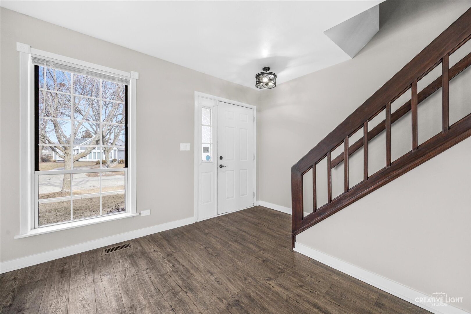 1221 Longford Circle Elgin, IL 60120 - Photo 2 of 29 a view of an entryway with wooden floor