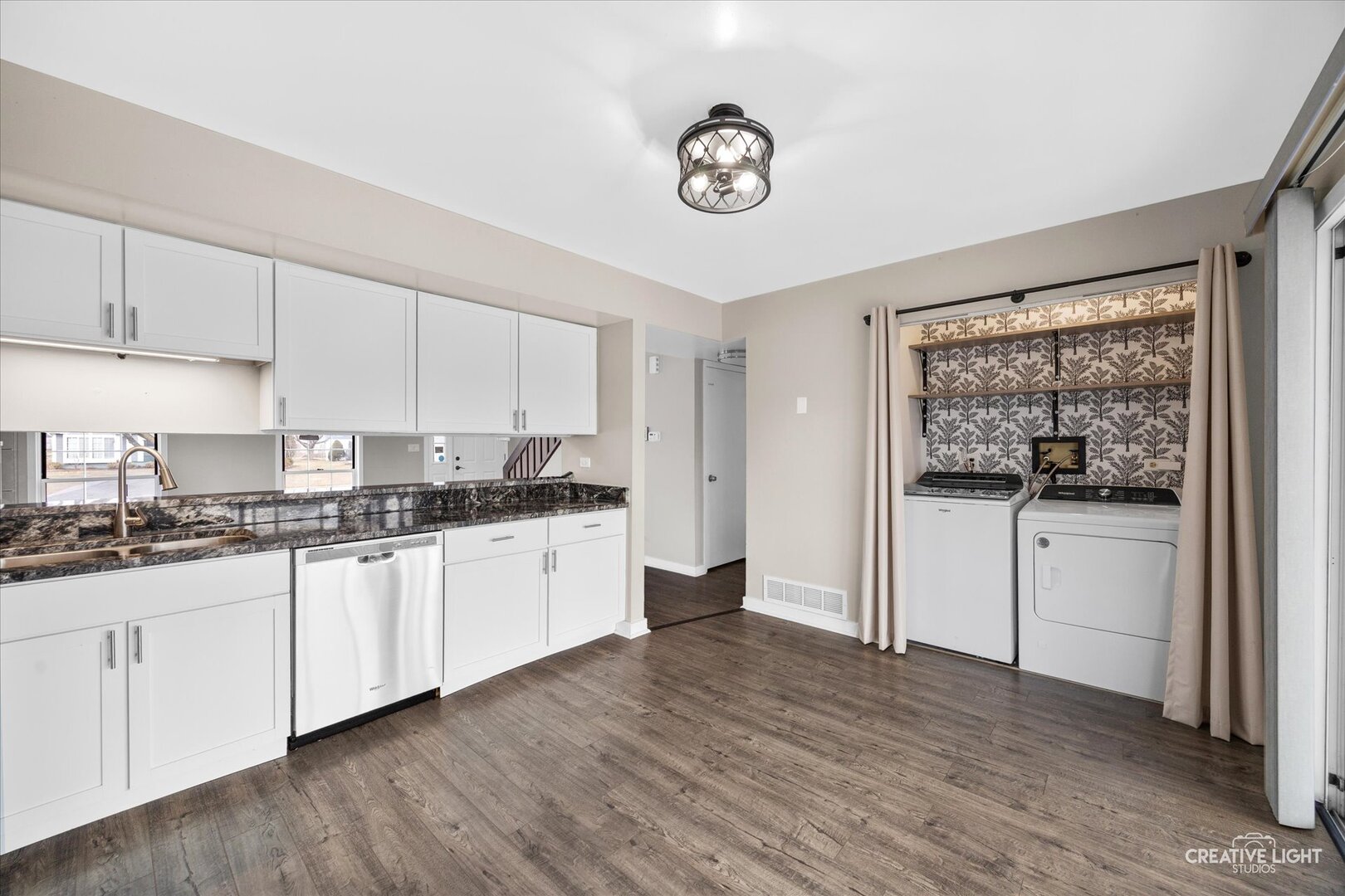 1221 Longford Circle Elgin, IL 60120 - Photo 7 of 29 a kitchen with granite countertop white cabinets and white appliances