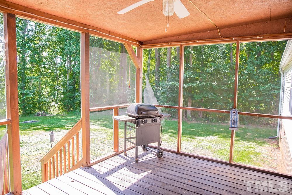 800 Woodsdale Road Roxboro, NC 27574 - Photo 12 of 54 a view of a patio with a big yard