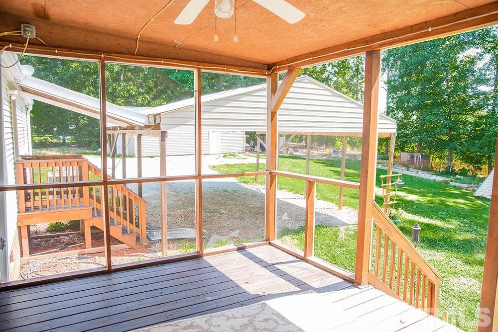 800 Woodsdale Road Roxboro, NC 27574 - Photo 13 of 54 a view of backyard with a deck and wooden floor