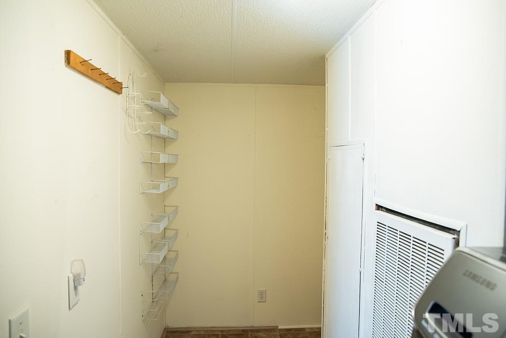 800 Woodsdale Road Roxboro, NC 27574 - Photo 14 of 54 a bathroom with a shower and a curtain