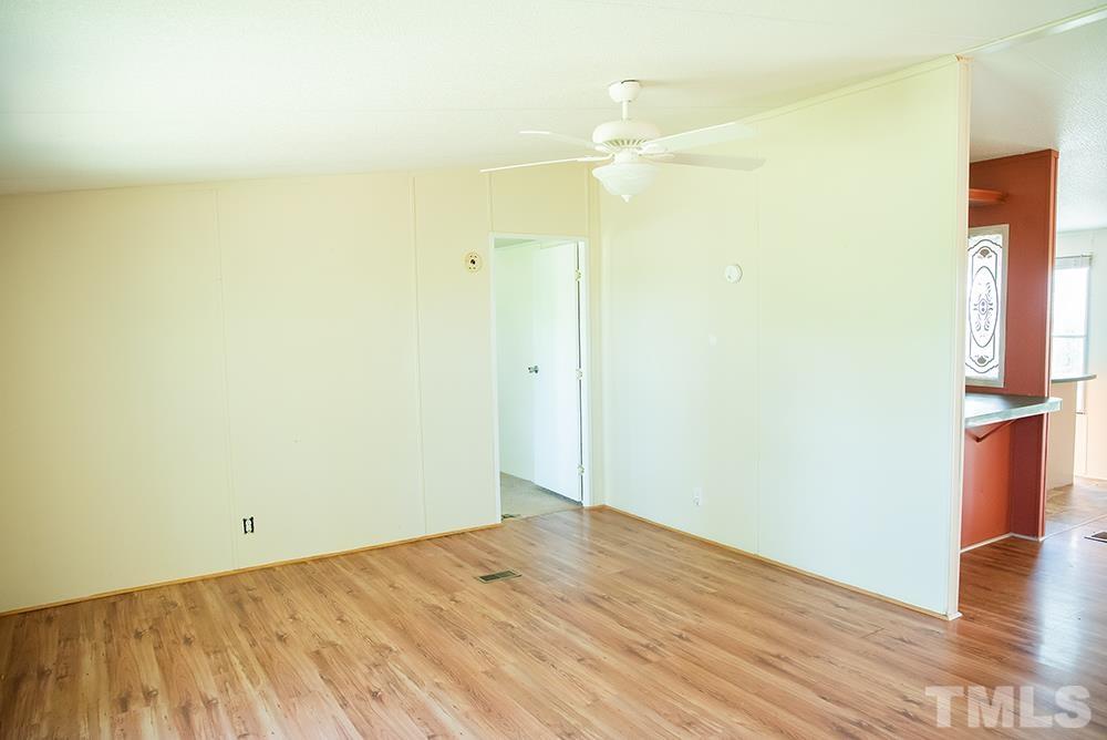 800 Woodsdale Road Roxboro, NC 27574 - Photo 19 of 54 a view of empty room with wooden floor