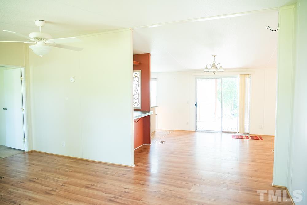 800 Woodsdale Road Roxboro, NC 27574 - Photo 20 of 54 a view of empty room with wooden floor