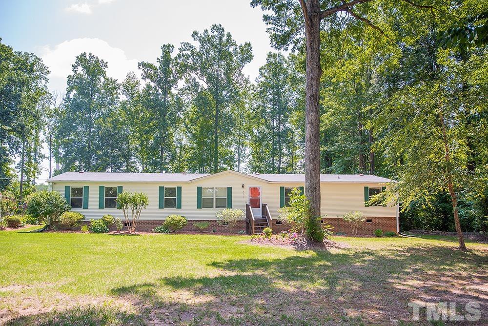 800 Woodsdale Road Roxboro, NC 27574 - Photo 2 of 54 a front view of a house with yard patio and swimming pool