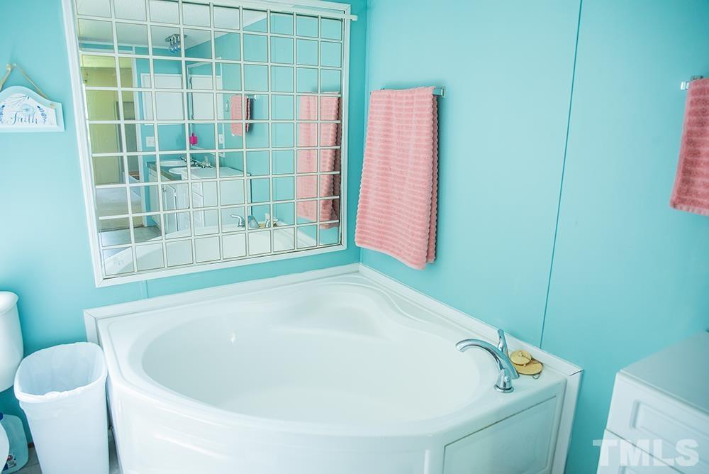 800 Woodsdale Road Roxboro, NC 27574 - Photo 28 of 54 a bathroom with a bathtub