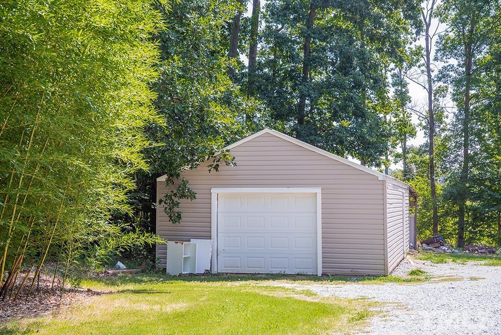 800 Woodsdale Road Roxboro, NC 27574 - Photo 3 of 54 a view of a house with a backyard