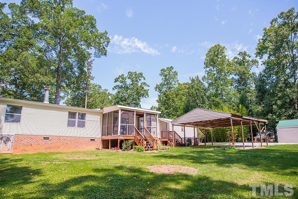 800 Woodsdale Road Roxboro, NC 27574 - Photo 44 of 54 a view of a house with a yard