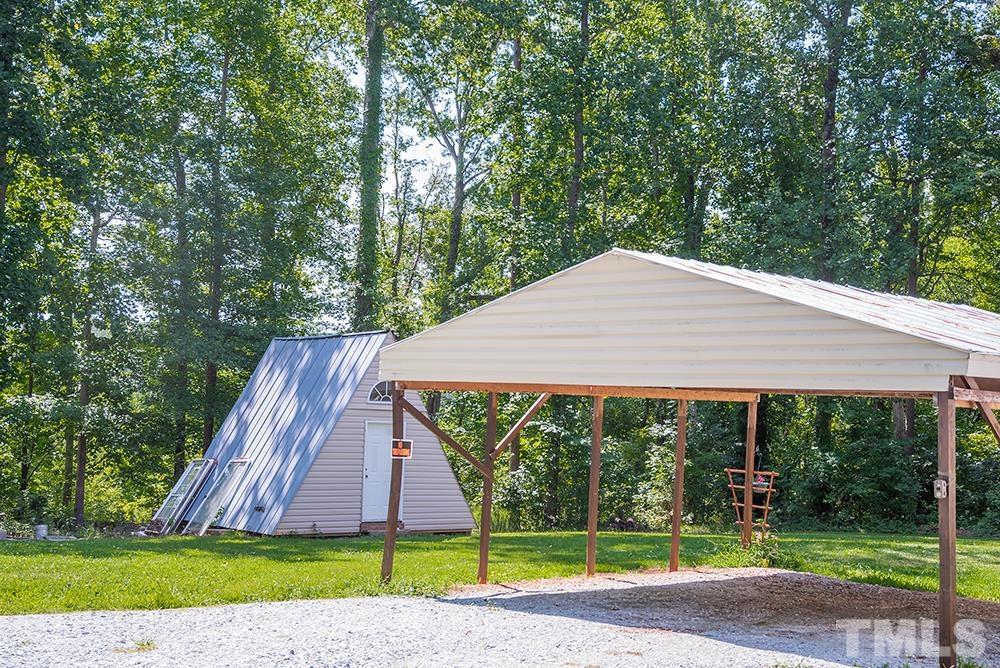 800 Woodsdale Road Roxboro, NC 27574 - Photo 49 of 54 a view of a house with a yard