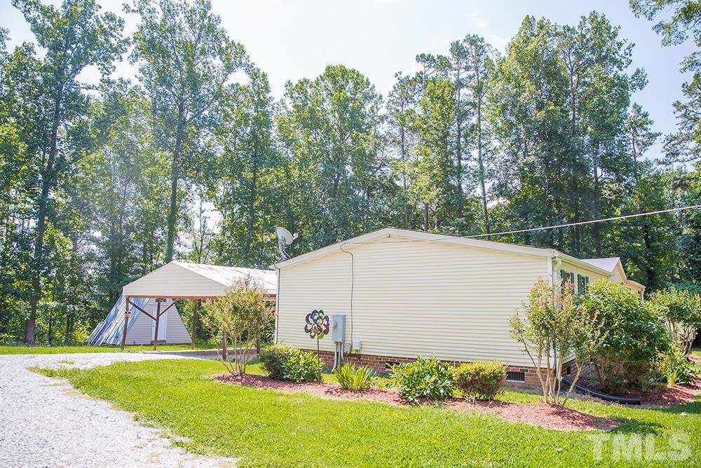 800 Woodsdale Road Roxboro, NC 27574 - Photo 51 of 54 a view of a house with backyard and sitting area