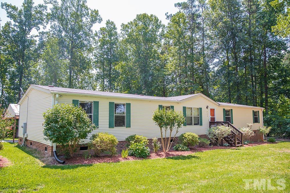 800 Woodsdale Road Roxboro, NC 27574 - Photo 52 of 54 front view of a house with a yard