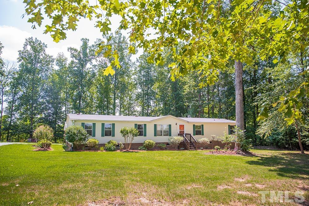 800 Woodsdale Road Roxboro, NC 27574 - Photo 54 of 54 a front view of a house with garden