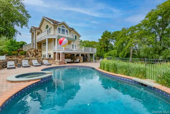 a view of a house with a yard and a fountain