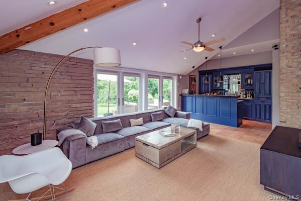 27 West Tiana Road Hampton Bays, NY 11946 - Photo 12 of 21 a living room with furniture and a large window
