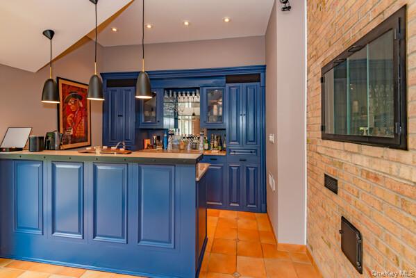27 West Tiana Road Hampton Bays, NY 11946 - Photo 13 of 21 a open kitchen with stainless steel appliances granite countertop a refrigerator and wooden cabinets