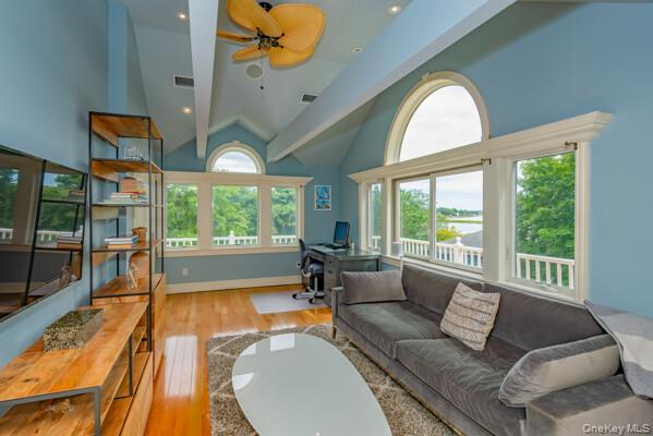 27 West Tiana Road Hampton Bays, NY 11946 - Photo 15 of 21 a living room with furniture and a large window
