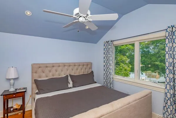 a bed sitting in a room next to a window