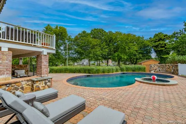 a view of a backyard with sitting area