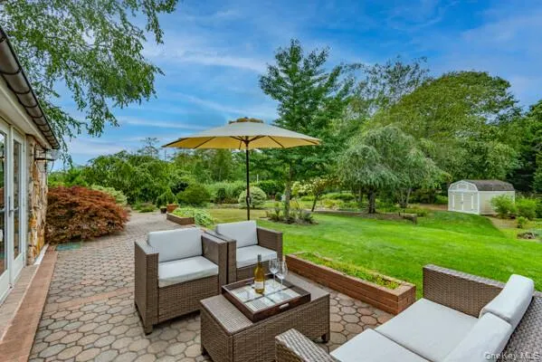 a view of a backyard with sitting area