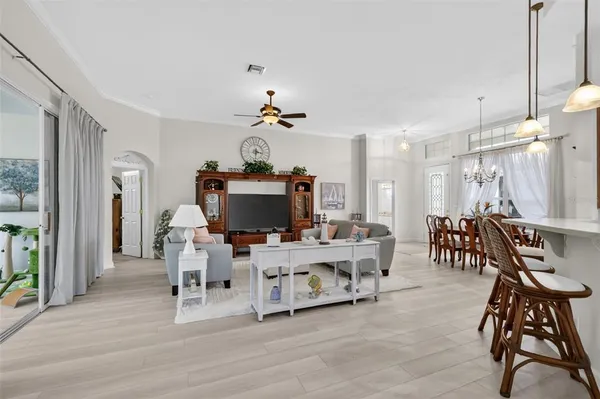 a view of a livingroom with furniture and a flat screen tv