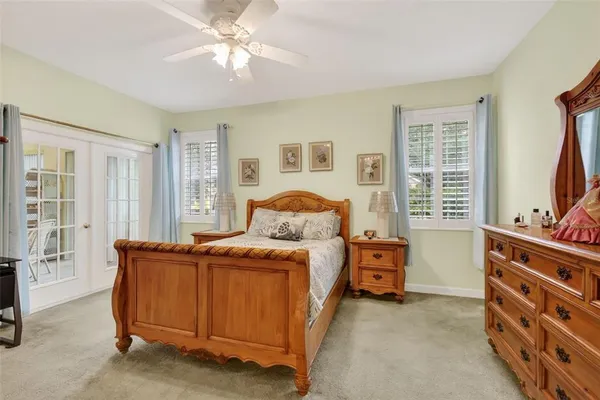 a bedroom with furniture and a window