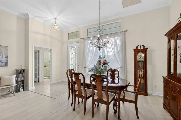 a view of a dining room with furniture window and wooden floor