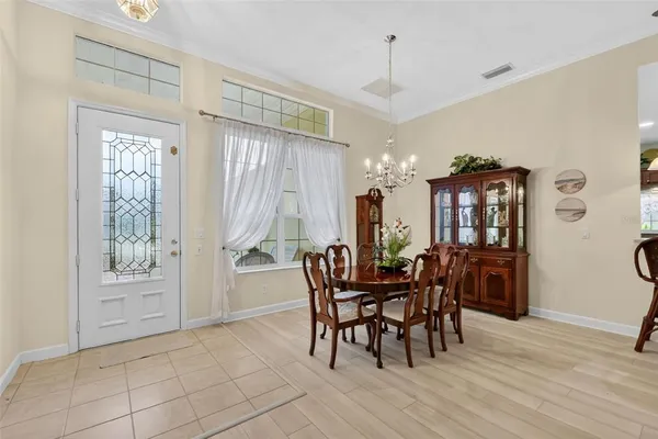 a view of a dining room with furniture and window