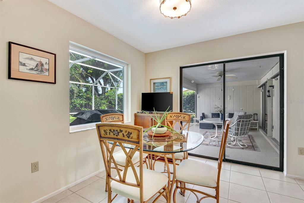 1235 Pine Needle Road Venice, FL 34285 - Photo 17 of 74 a living room with furniture and a flat screen tv