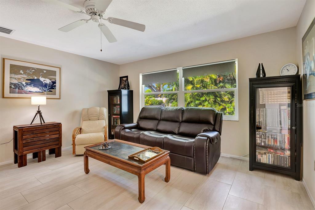 1235 Pine Needle Road Venice, FL 34285 - Photo 23 of 74 a living room with furniture and a window