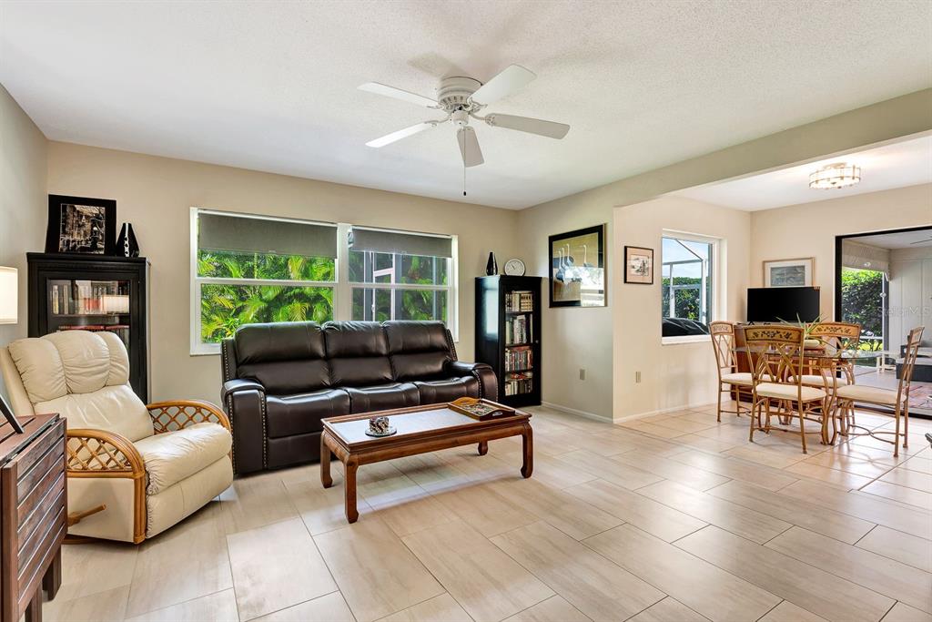 1235 Pine Needle Road Venice, FL 34285 - Photo 25 of 74 a living room with furniture and a window