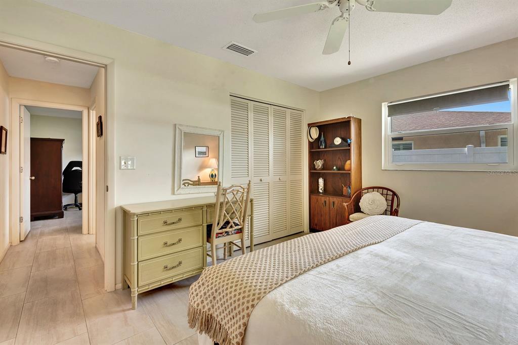 1235 Pine Needle Road Venice, FL 34285 - Photo 36 of 74 a bedroom with a bed and a dresser