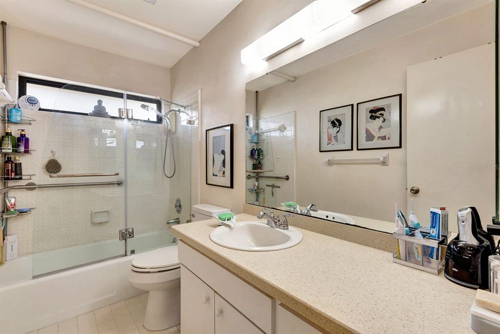 1235 Pine Needle Road Venice, FL 34285 - Photo 38 of 74 a bathroom with a sink a toilet and shower