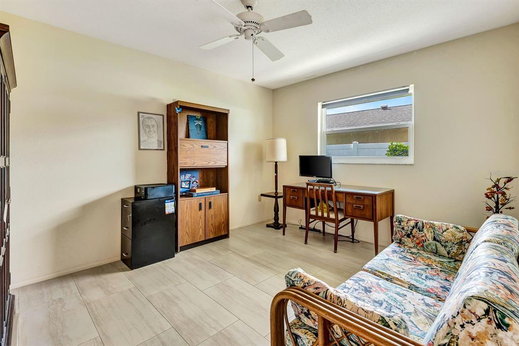 1235 Pine Needle Road Venice, FL 34285 - Photo 39 of 74 a living room with furniture and wooden floor