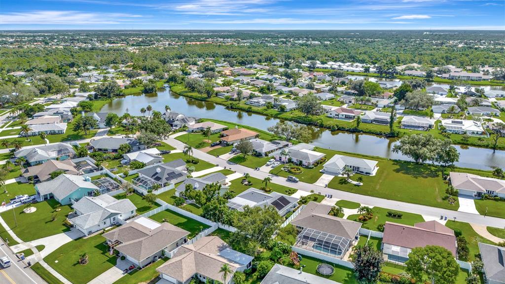 1235 Pine Needle Road Venice, FL 34285 - Photo 43 of 74 an aerial view of residential houses with outdoor space