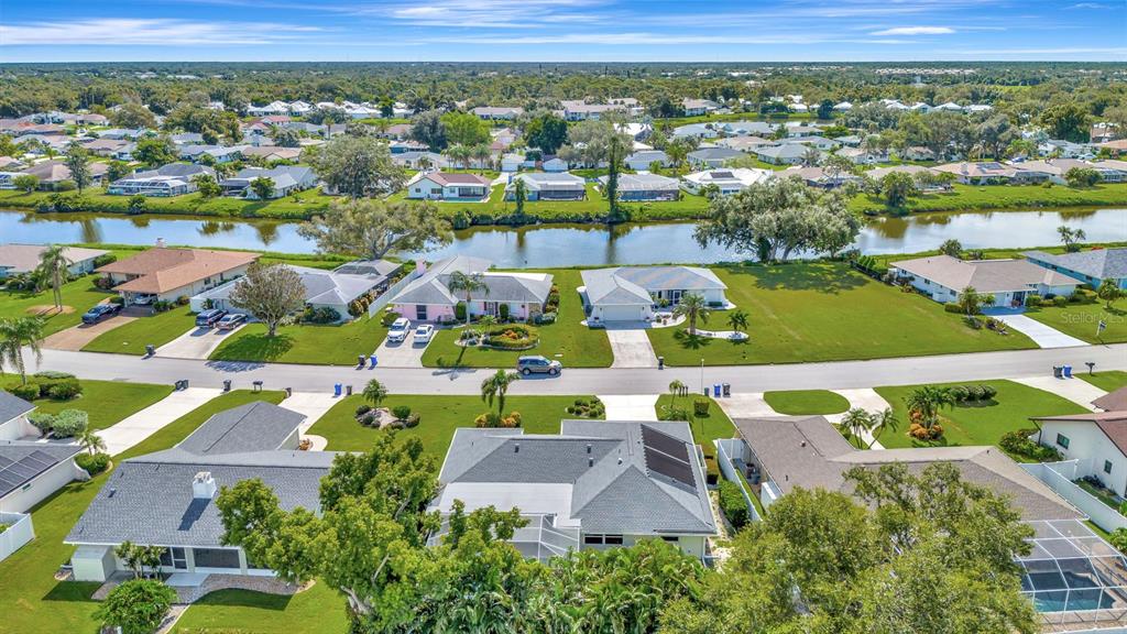 1235 Pine Needle Road Venice, FL 34285 - Photo 45 of 74 an aerial view of residential houses with outdoor space and parking