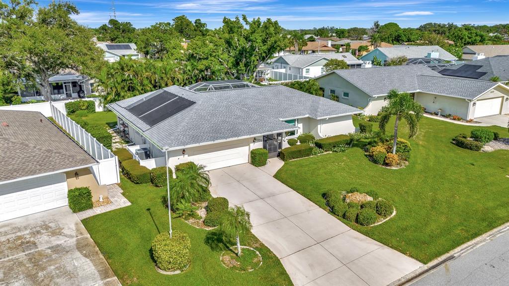 1235 Pine Needle Road Venice, FL 34285 - Photo 47 of 74 an aerial view of a house with garden space and street view