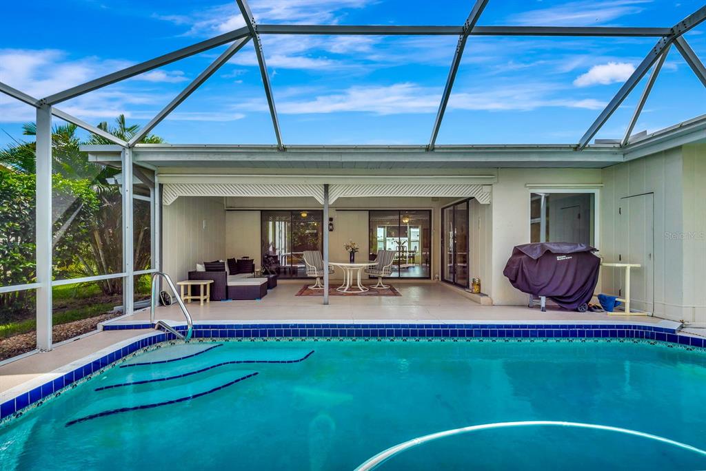 1235 Pine Needle Road Venice, FL 34285 - Photo 52 of 74 a front view of house with outdoor seating and deck