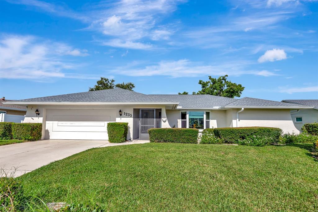 1235 Pine Needle Road Venice, FL 34285 - Photo 56 of 74 a front view of a house with a yard