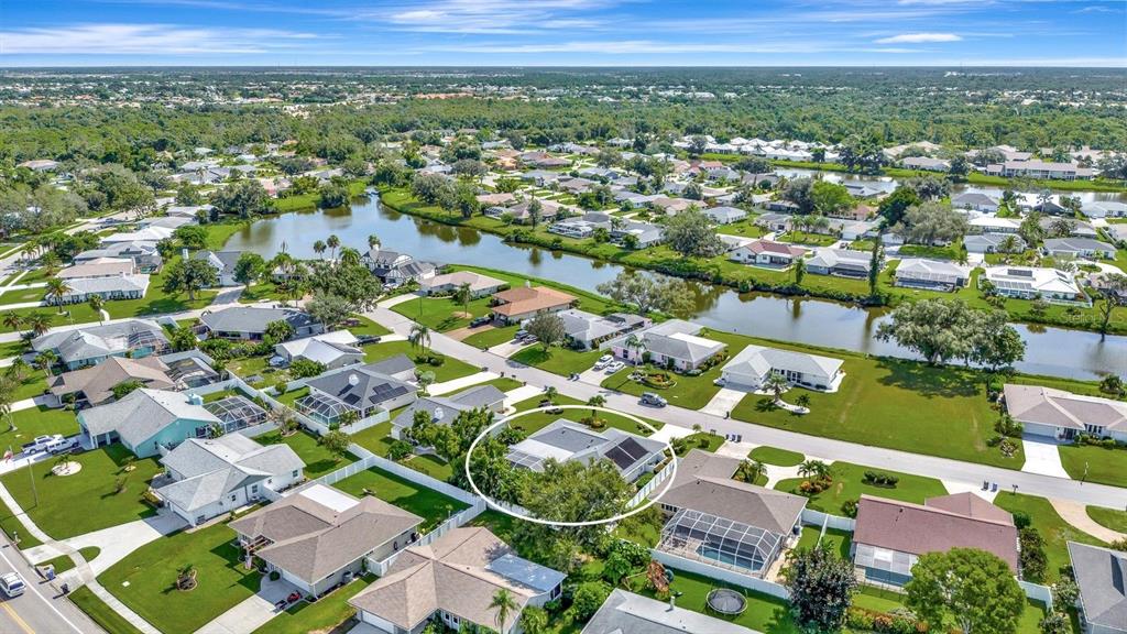 1235 Pine Needle Road Venice, FL 34285 - Photo 61 of 74 an aerial view of residential houses with outdoor space