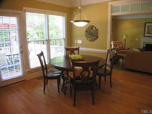 5701 Stuart Ridge Road Wake Forest, NC 27587 - Photo 4 of 12 a view of a dining room with furniture and window